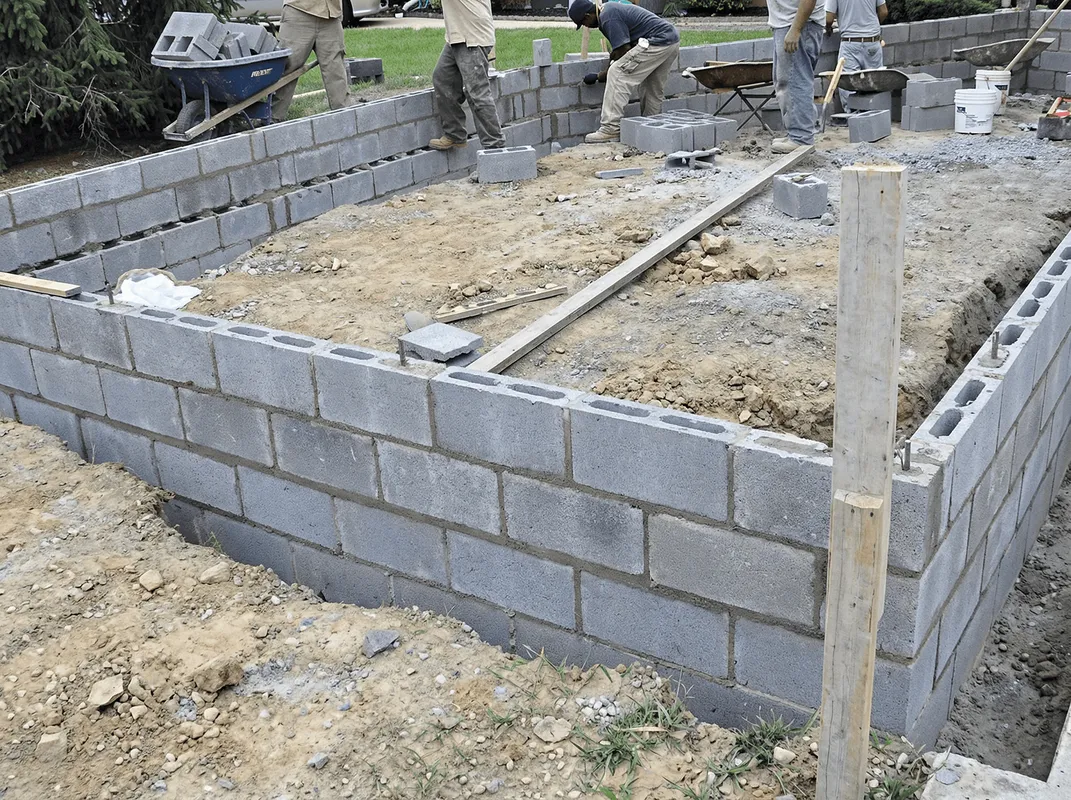 Professionals building a foundation with blocks in Rochester, NY