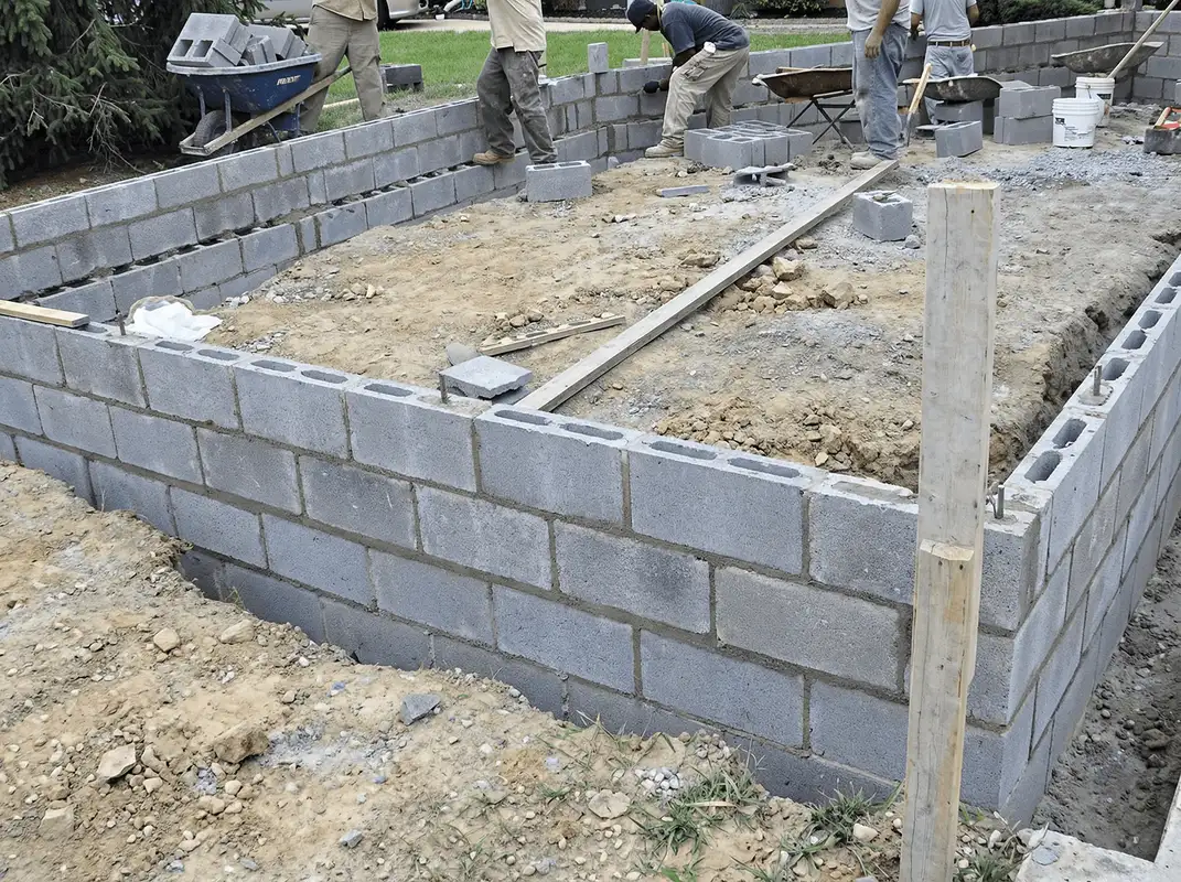 Professionals building a foundation with blocks in Rochester, NY