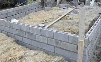 Professionals building a foundation with blocks in Rochester, NY