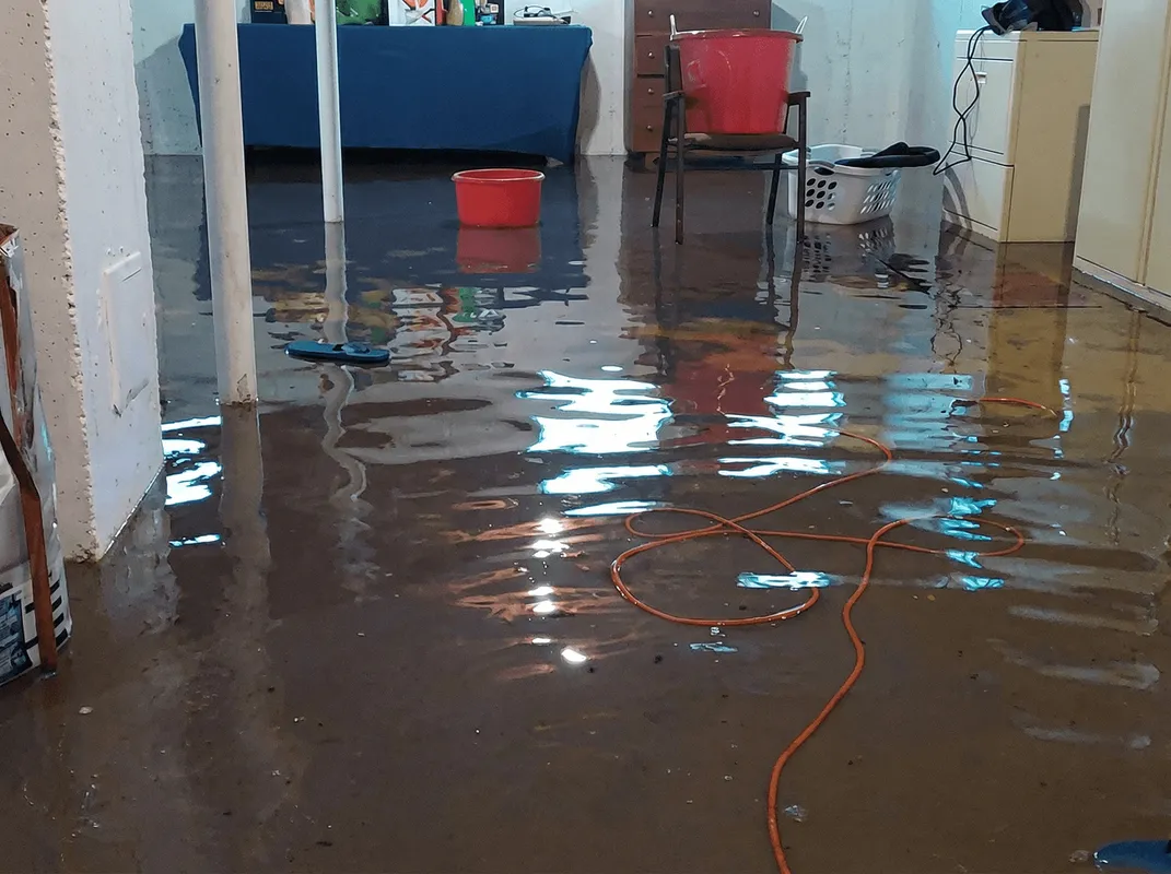 Basement with boiler, cabinets and washing machine completely flooded in Rochester, NY